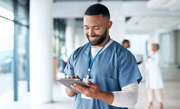 Healthcare, doctor and black man with tablet for telehealth, research and consulting patient online. Hospital, insurance and male with digital tech for medical report, data analysis and wellness app
