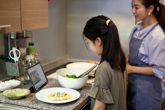  [Alt text: Woman and her daughter use MapHabit to make quesadillas together.